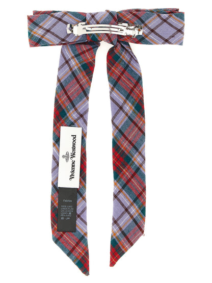 This Hair Pin by Vivienne Westwood for women in cotton multicolor, patterned, tartan & signature presents a ornamental silhouette, showcasing the ornamental details and refined style of the Orb Linen Hair Pin.