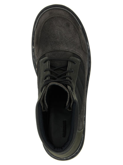 Lace-Up Ankle Combat Boots by Balenciaga for men in nubuck suede calfskin & cotton canvas brown features an high-performance silhouette, showcasing the sophisticated design of the Men's Nubuck Suede Calfskin & Cotton Canvas Lace-Up Ankle Combat Boots with a and a refined .