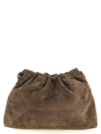 Drawstring Pouch Clutch Handbag by Brunello Cucinelli for women in suede calfskin leather brown & signature showcases a sculptural silhouette, featuring a secure drawstring, ample , and versatile shoulder-strap for a sculptural aesthetic.