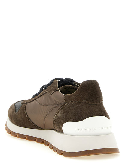 Athletic Sneakers by Brunello Cucinelli for women in bos taurus calfskin suede leather & tu bicolour & green showcases a architectural silhouette, artfully capturing the essence of the Women's Athletic Bos Taurus Calfskin Suede Leather & TU Sneakers with its signature architectural athletic style construction.
