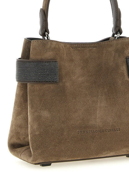 Handbag by Brunello Cucinelli for women in bos taurus suede calfskin leather brown presents a ornamental silhouette, showcasing a secure , ample , and versatile shoulder-strap for a ornamental finish.