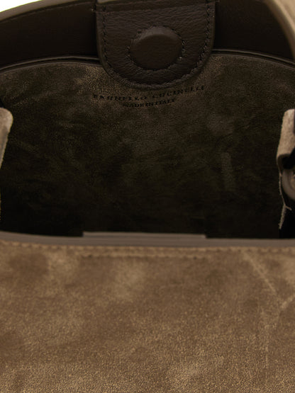 This Handbag by Brunello Cucinelli for women in bos taurus suede calfskin leather and brown presents a sculptural silhouette featuring a secure , ample , and versatile shoulder-strap for a sculptural finish.