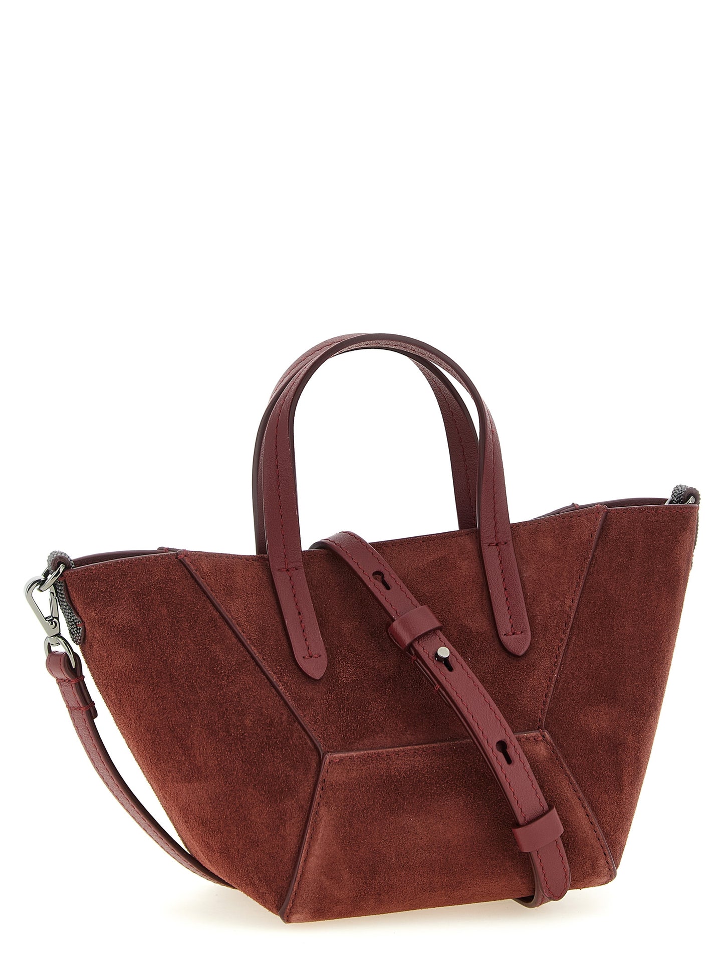 This Mini Handbag by Brunello Cucinelli for women in suede calfskin leather and bordeaux presents a sculptural silhouette featuring a secure magnetic, ample , and versatile shoulder-strap, adjustable-strap & handle for a sculptural finish.