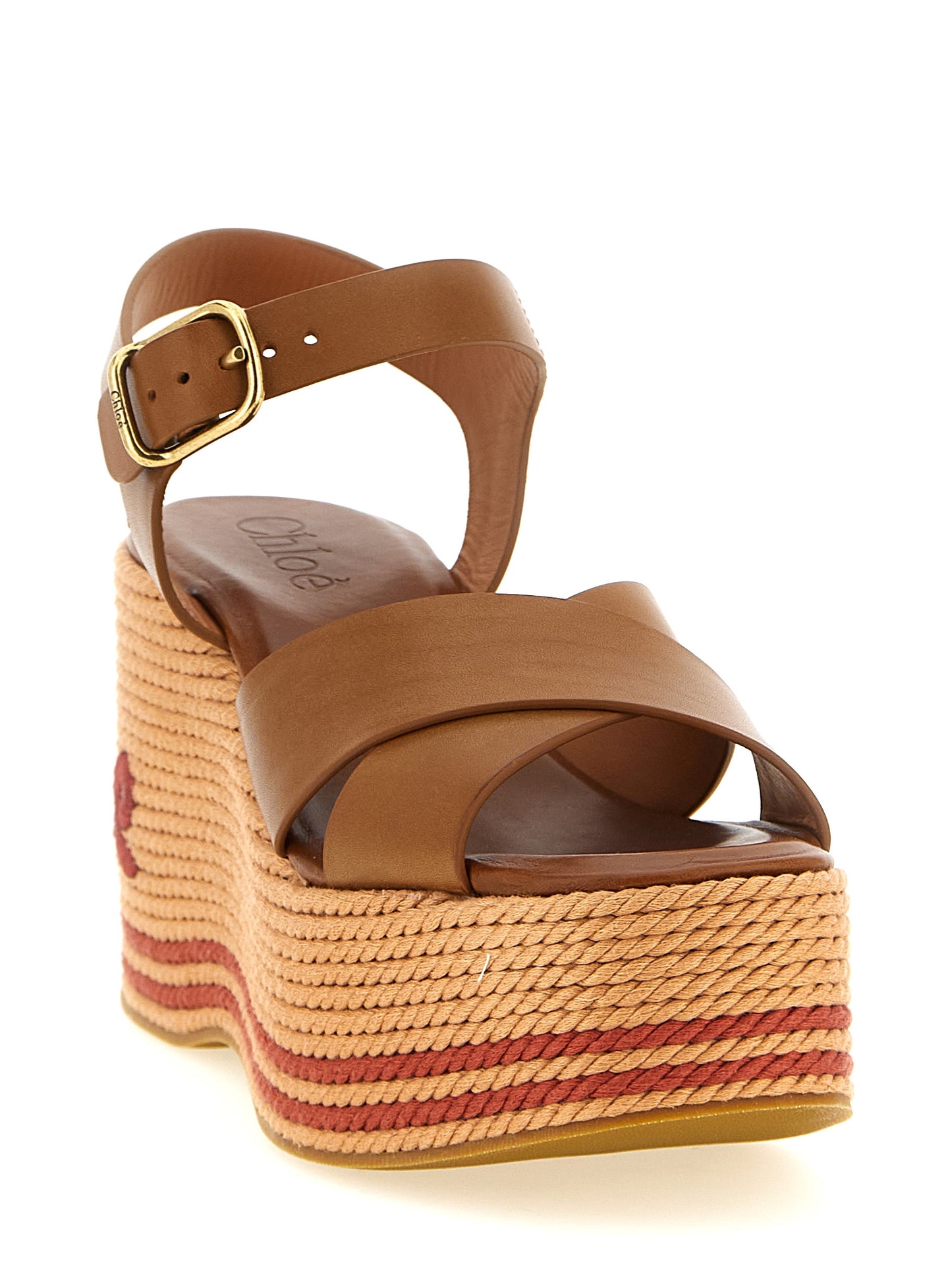 Wedge Ankle Strap Sandals by Chloé for women in calfskin leather & tu and brown & signature presents a captivating silhouette, showcasing the signature style of the Women's Calfskin Leather & TU Wedge Ankle Strap Sandals with a captivating wedge and captivating .