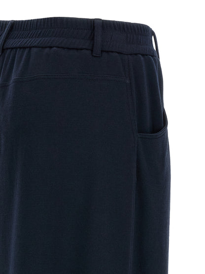 Trousers by Brunello Cucinelli for women in polyamide cotton silk blue presents a smart silhouette, meticulously detailed with a smart wide, a smart long, and a smart .