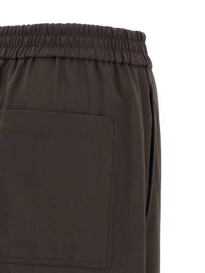 Trousers by Brunello Cucinelli for women in virgin wool & polyamide brown features an sartorial silhouette, showcasing a precise straight-leg & wide and long with a sartorial for a refined look.