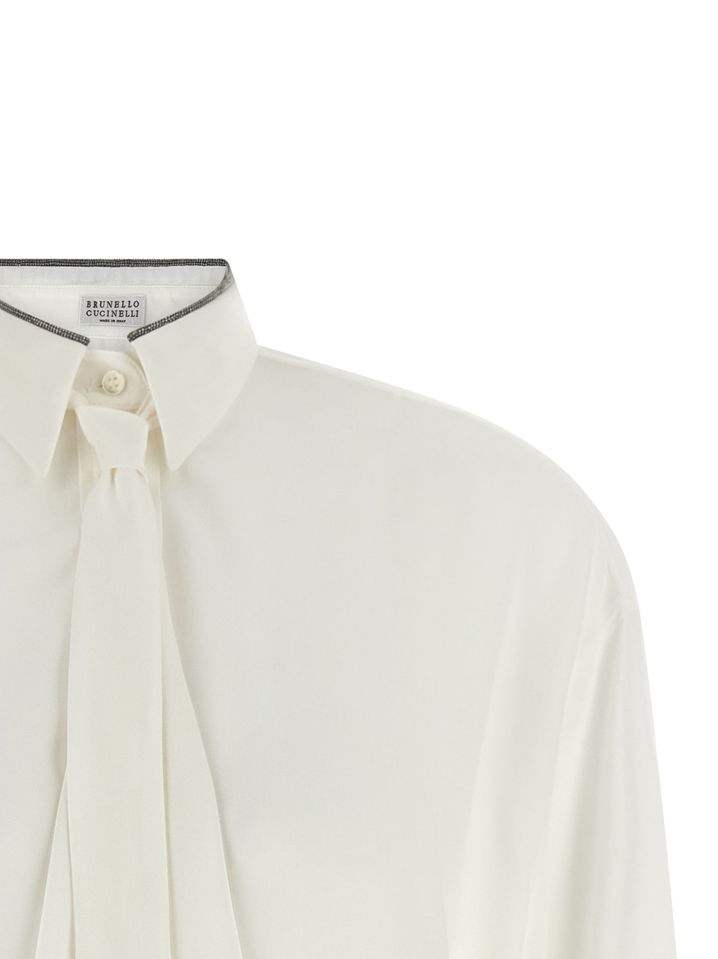 Blouse by Brunello Cucinelli for women in silk white showcases a sharp silhouette, elegantly detailed with a sharp asymmetric neckline and sharp .