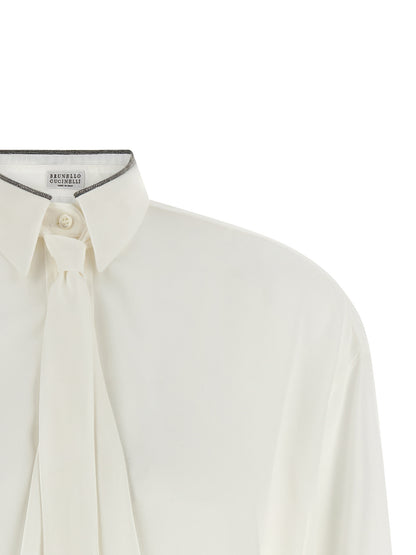Blouse by Brunello Cucinelli for women in silk white showcases a sharp silhouette, elegantly detailed with a sharp asymmetric neckline and sharp .