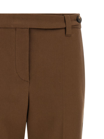 Trousers by Brunello Cucinelli for women in stretch cotton twill brown presents a perennial silhouette, meticulously tailored with a tapered-leg & cropped cut, cropped finish, and an elegant .