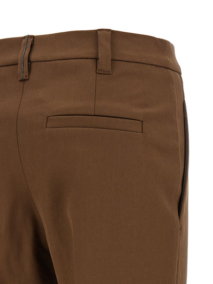 Trousers by Brunello Cucinelli for women in stretch cotton twill brown presents a smart silhouette, meticulously detailed with a smart tapered-leg & cropped, a smart cropped, and a smart .