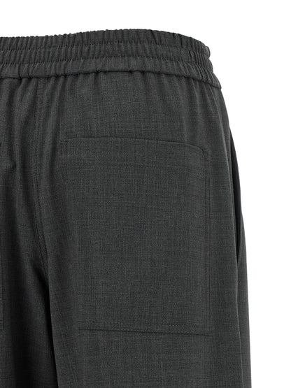 Trousers by Brunello Cucinelli for women in virgin wool & polyamide gray features an sartorial silhouette, showcasing a precise flared & wide and long with a sartorial for a refined look.