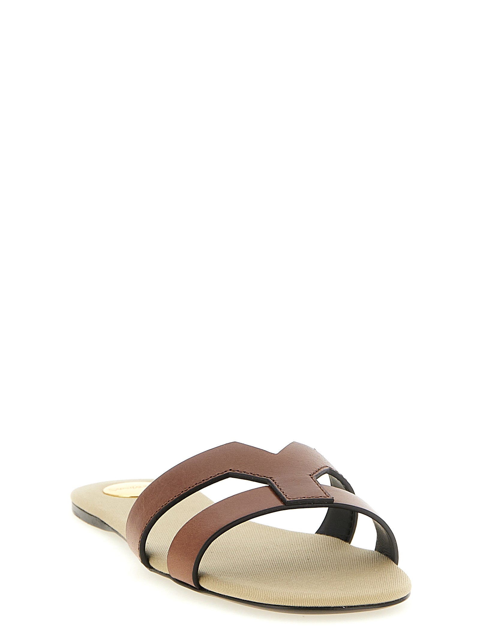 Sliders Sandals Flat Shoes by Saint Laurent for women in calfskin leather brown features an statuesque silhouette from the Women's Calfskin Leather Sliders Sandals Flat Shoes collection, showcasing a and a statuesque for a statuesque look.
