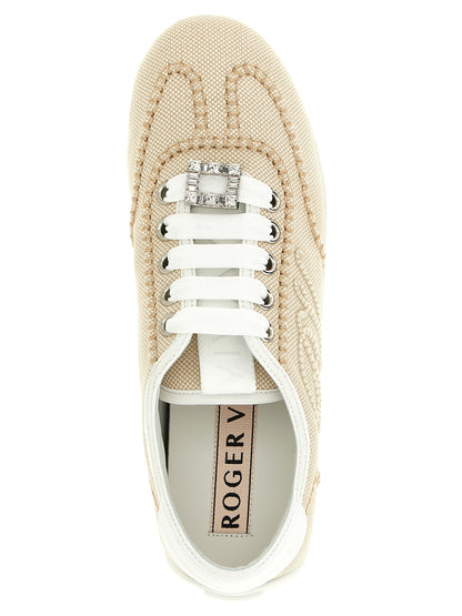 Sneakers by Roger Vivier for women in polyamide leather beige presents a sumptuous silhouette, artfully capturing the essence of the Viv Women's Low Top Polyamide Leather Sneakers with its sumptuous low-top style design.