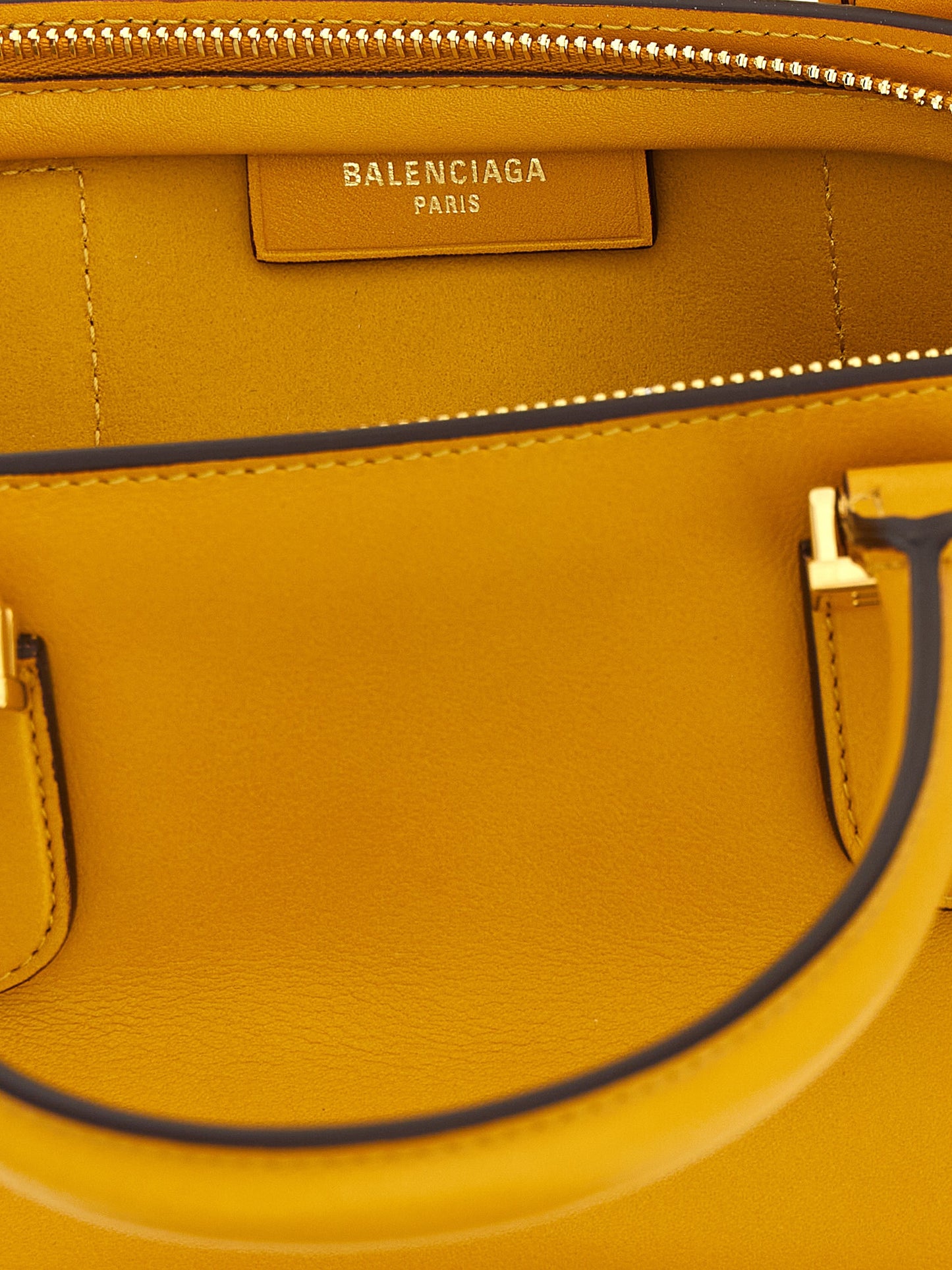 Mini Bowling Handbag by Balenciaga for women in calfskin leather bicolour & yellow presents a ornamental silhouette, showcasing a secure zipper, ample , and versatile shoulder-strap, adjustable-strap & handle for a ornamental finish.