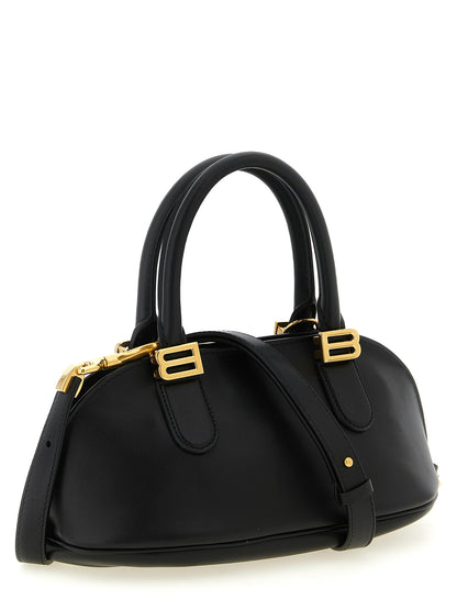 Mini Bowling Handbag by Balenciaga for women in calfskin leather black features a signature silhouette, showcasing a secure zipper and signature with versatile shoulder-strap & adjustable-strap for a sophisticated look.