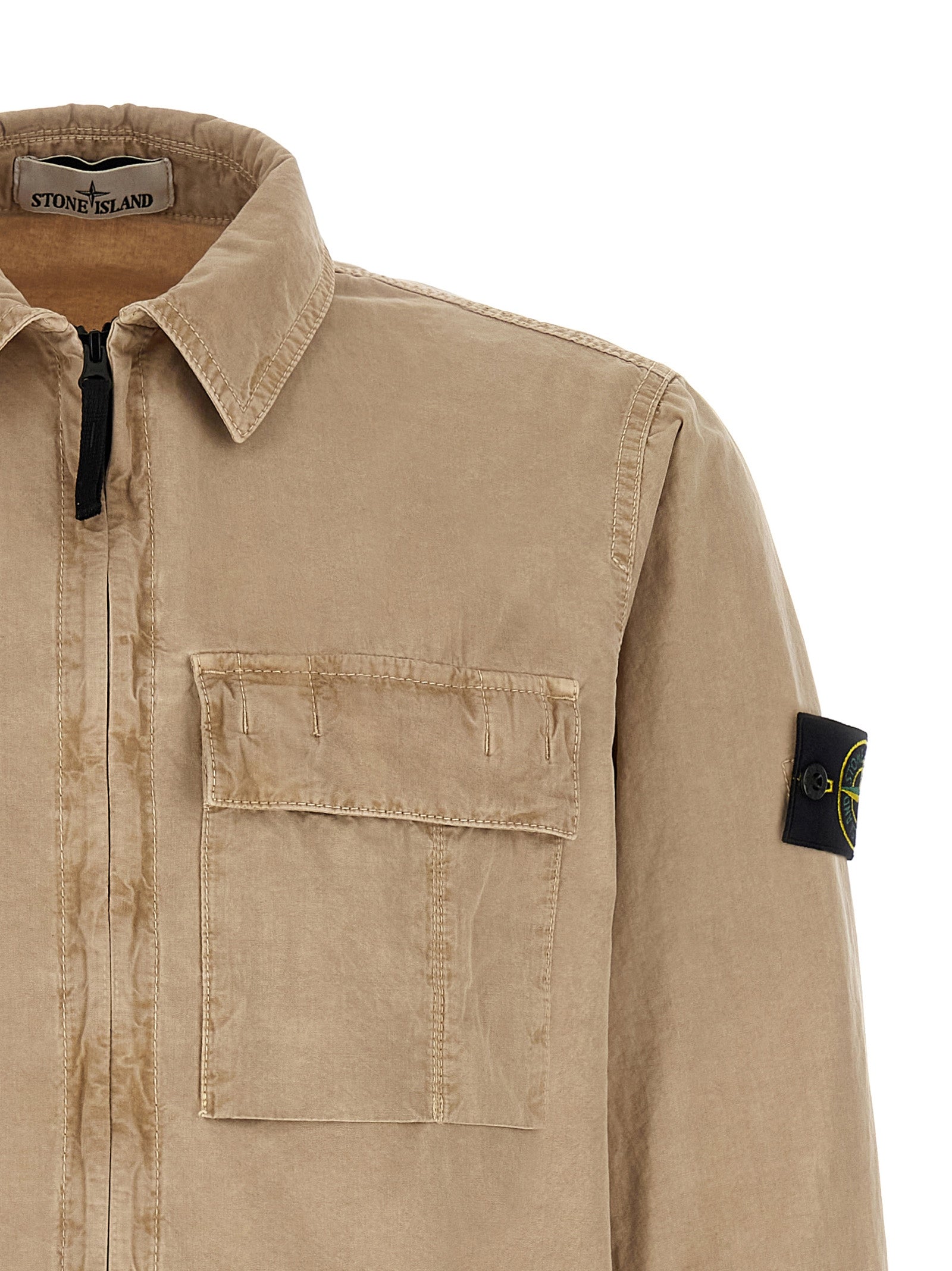 Overshirt by Stone Island for men in cotton canvas beige & signature features an architectural silhouette with a refined and elegant for a architectural look.