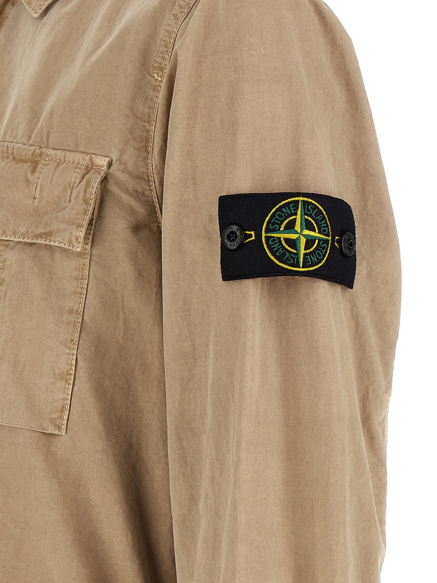 Overshirt by Stone Island for men in cotton canvas beige & signature showcases a sleek silhouette, elegantly detailed with a sleek and for a sleek finish.