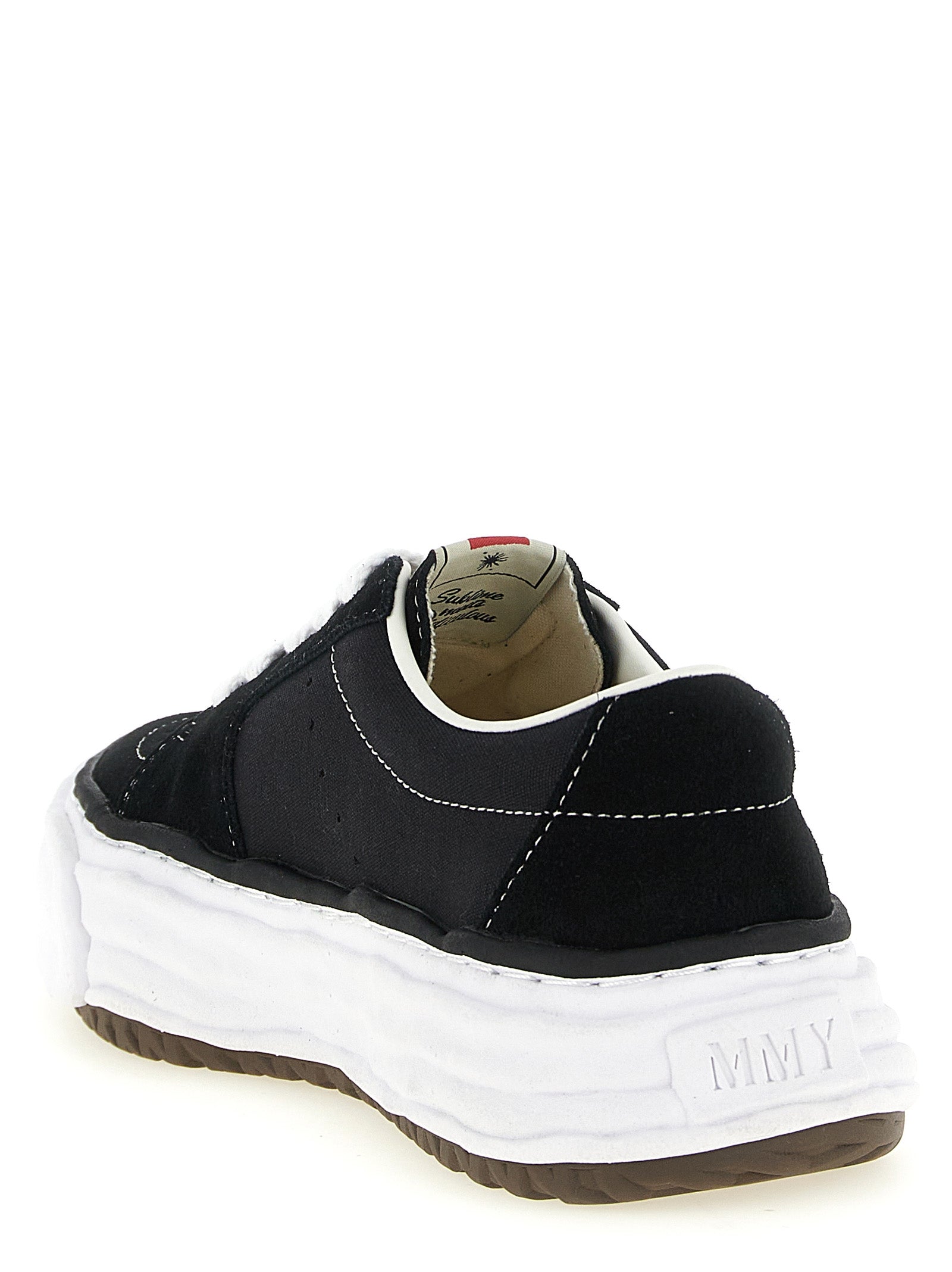 Sneakers by Maison Mihara Yasuhiro for men in suede cowhide leather & canvas black presents a sumptuous silhouette, artfully capturing the essence of the Men's Fashion Suede Cowhide Leather & Canvas Sneakers with its sumptuous fashion style design.