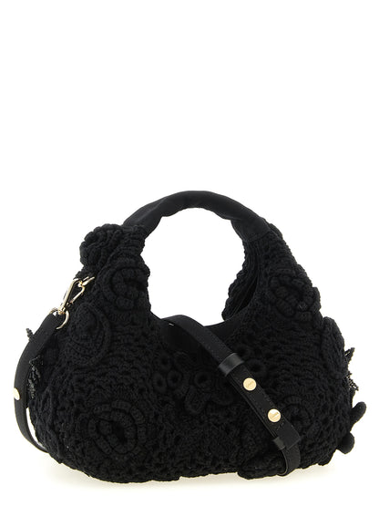 This Mini Hobo Handbag by Ganni for women in organic cotton & leather and black & floral presents a sculptural silhouette featuring a secure magnetic, ample , and versatile shoulder-strap & adjustable-strap for a sculptural finish.