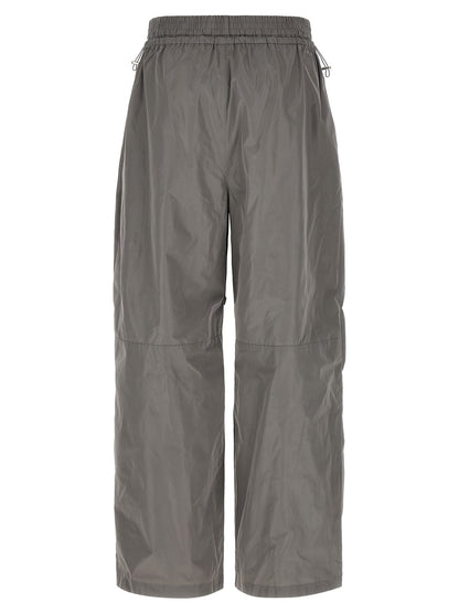 Joggers by Alexander Wang for women in polyester gray features a polished silhouette with a polished athletic & wide, reaching a polished long and finished with a polished .