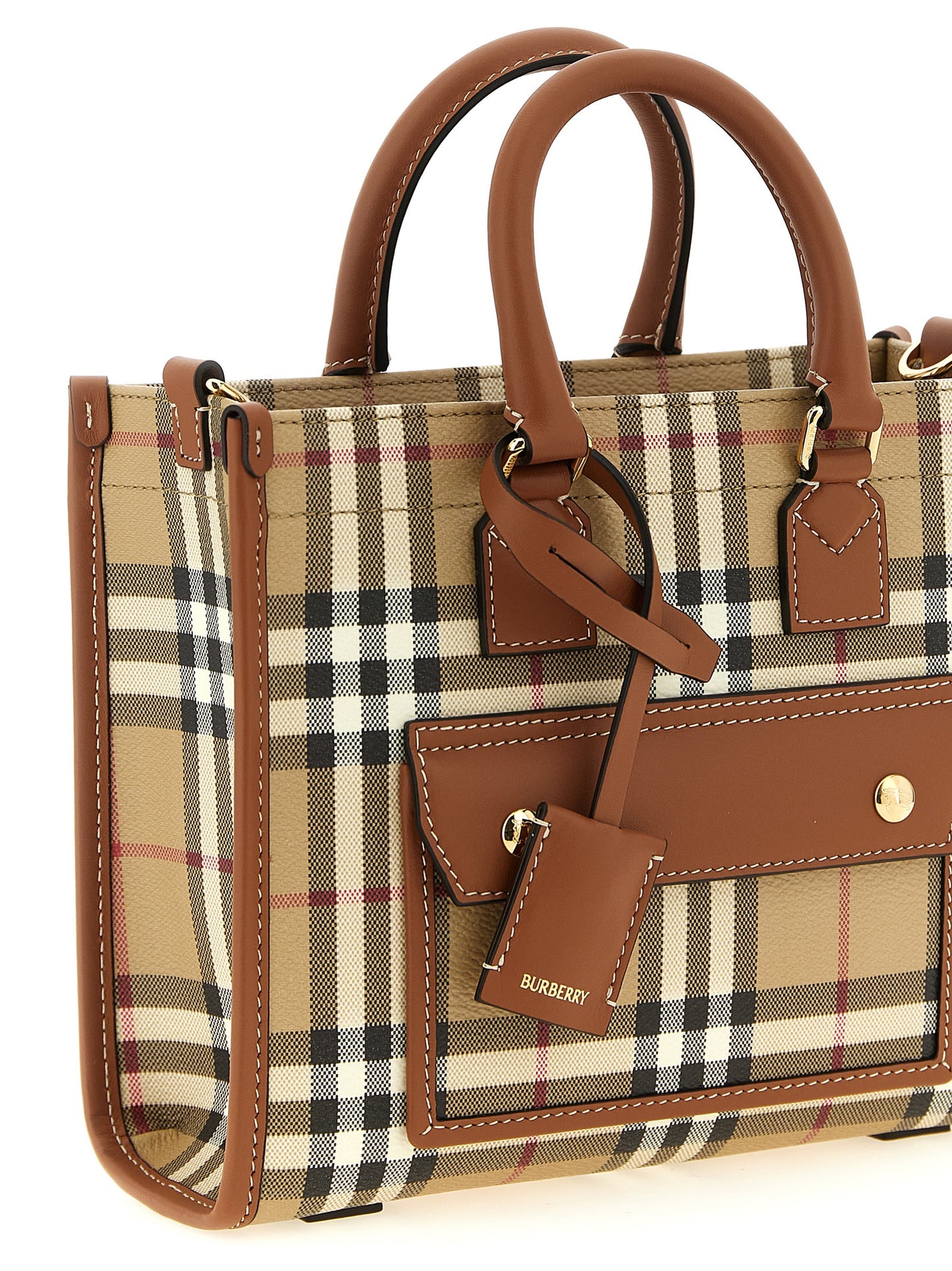 Mini Crossbody Travel Satchel Tote Bag by Burberry for women in poly cotton & calfskin leather beige features an utilitarian-chic silhouette, showcasing the Freya Poly Cotton & Calfskin Leather Mini Crossbody Travel Satchel Tote Bag design with a secure , ample external-pockets, and versatile crossbody-strap, shoulder-strap, adjustable-strap & detachable-strap.