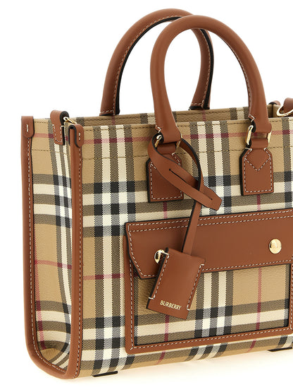 Mini Crossbody Travel Satchel Tote Bag by Burberry for women in poly cotton & calfskin leather beige features an utilitarian-chic silhouette, showcasing the Freya Poly Cotton & Calfskin Leather Mini Crossbody Travel Satchel Tote Bag design with a secure , ample external-pockets, and versatile crossbody-strap, shoulder-strap, adjustable-strap & detachable-strap.