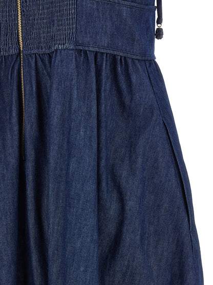 Dress by Zimmermann for women in denim cotton blue features an eye catching silhouette with a sophisticated , elegant , and a refined midi for a eye catching aesthetic.
