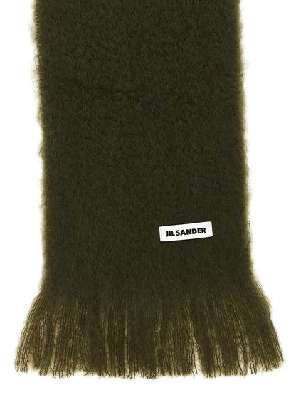 Scarf by Jil Sander for women in mohair wool & polyamide bicolour & green showcases a eye catching silhouette, artfully capturing the essence of the eye catching Mohair Wool & Polyamide Scarf design for a sophisticated look.
