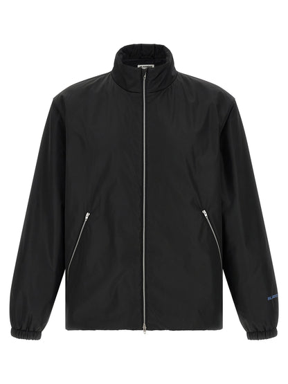 Overcoat by Jil Sander for men in polyester black showcases a architectural silhouette, artfully detailed with a distinctive high-neck neckline and functional pockets for a architectural finish.