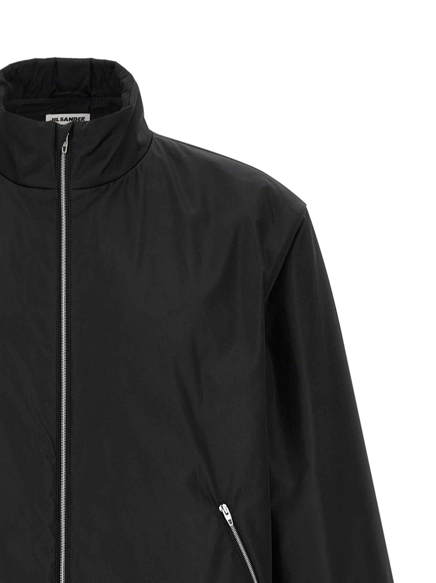 Overcoat by Jil Sander for men in polyester black features an voluminous silhouette, showcasing distinct pockets and a voluminous high-neck neckline for a truly voluminous aesthetic.