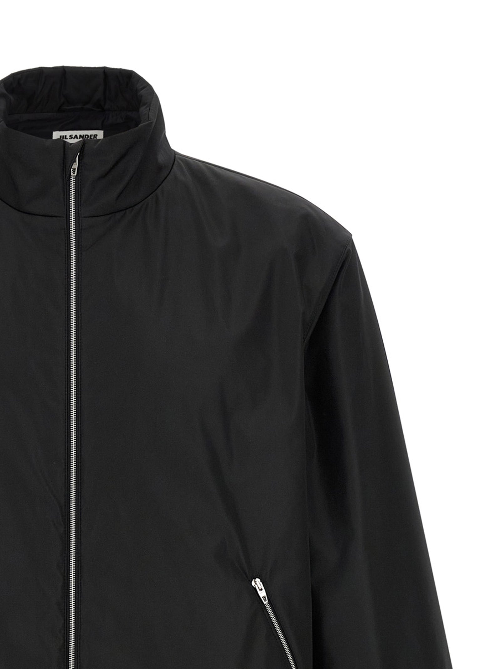 Overcoat by Jil Sander for men in polyester black features an voluminous silhouette, showcasing distinct pockets and a voluminous high-neck neckline for a truly voluminous aesthetic.