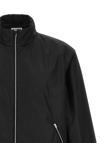 Overcoat by Jil Sander for men in polyester black features an voluminous silhouette, showcasing distinct pockets and a voluminous high-neck neckline for a truly voluminous aesthetic.
