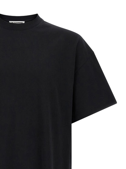 T-Shirt by Jil Sander for men in cotton bicolour, black, white & print showcases a dramatic silhouette, elegantly detailed with a dramatic crew neckline and for a truly dramatic finish.