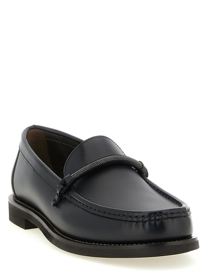 Flat Loafer Slip-On Shoes by Brunello Cucinelli for women in tu & calfskin leather black showcases a resplendent Monile Women's TU & Calfskin Leather Flat Loafer Slip-On Shoes aesthetic, defined by its resplendent and elegant flat.