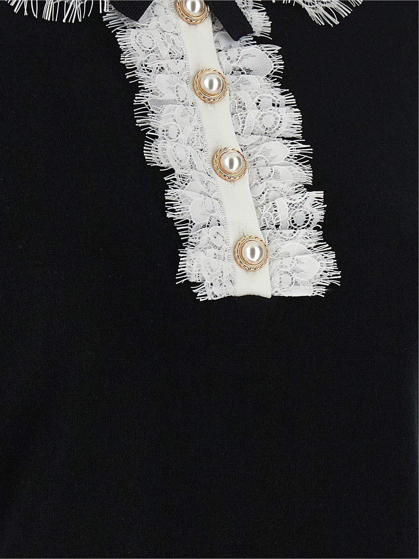 Blouse by Self-Portrait for women in wool bicolour, black & white features an architectural silhouette with a refined and elegant for a architectural look.
