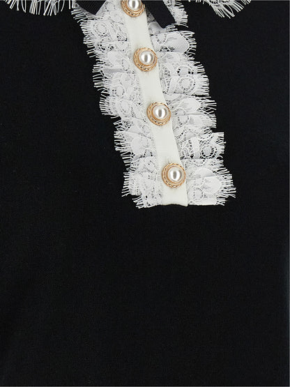 Blouse by Self-Portrait for women in wool bicolour, black & white features an architectural silhouette with a refined and elegant for a architectural look.