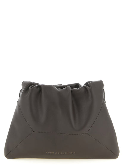 Drawstring Pouch Clutch Handbag by Brunello Cucinelli for women in calfskin leather brown showcases a sculptural silhouette, featuring a secure drawstring, ample , and versatile shoulder-strap for a sculptural finish.
