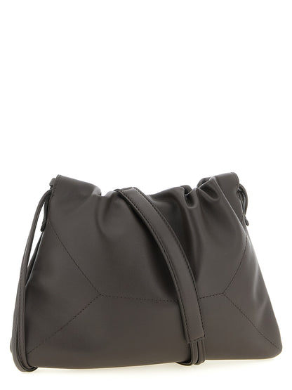 Drawstring Pouch Clutch Handbag by Brunello Cucinelli for women in calfskin leather brown features an sculptural silhouette, showcasing a secure drawstring and sculptural with versatile shoulder-strap for a sophisticated look.