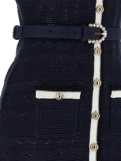 Dress by Self-Portrait for women in stretch poly cotton navy & floral features a dramatic silhouette, showcasing an elegant and that flows into a dramatic midi short.