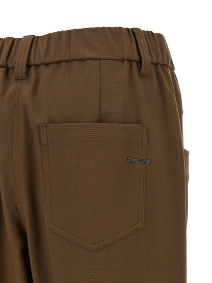 Trousers by Brunello Cucinelli for women in stretch cotton brown features a sculptural silhouette, showcasing a sculptural tapered-leg, relaxed-fit & wide and long with a sophisticated mid rise for a sculptural finish.