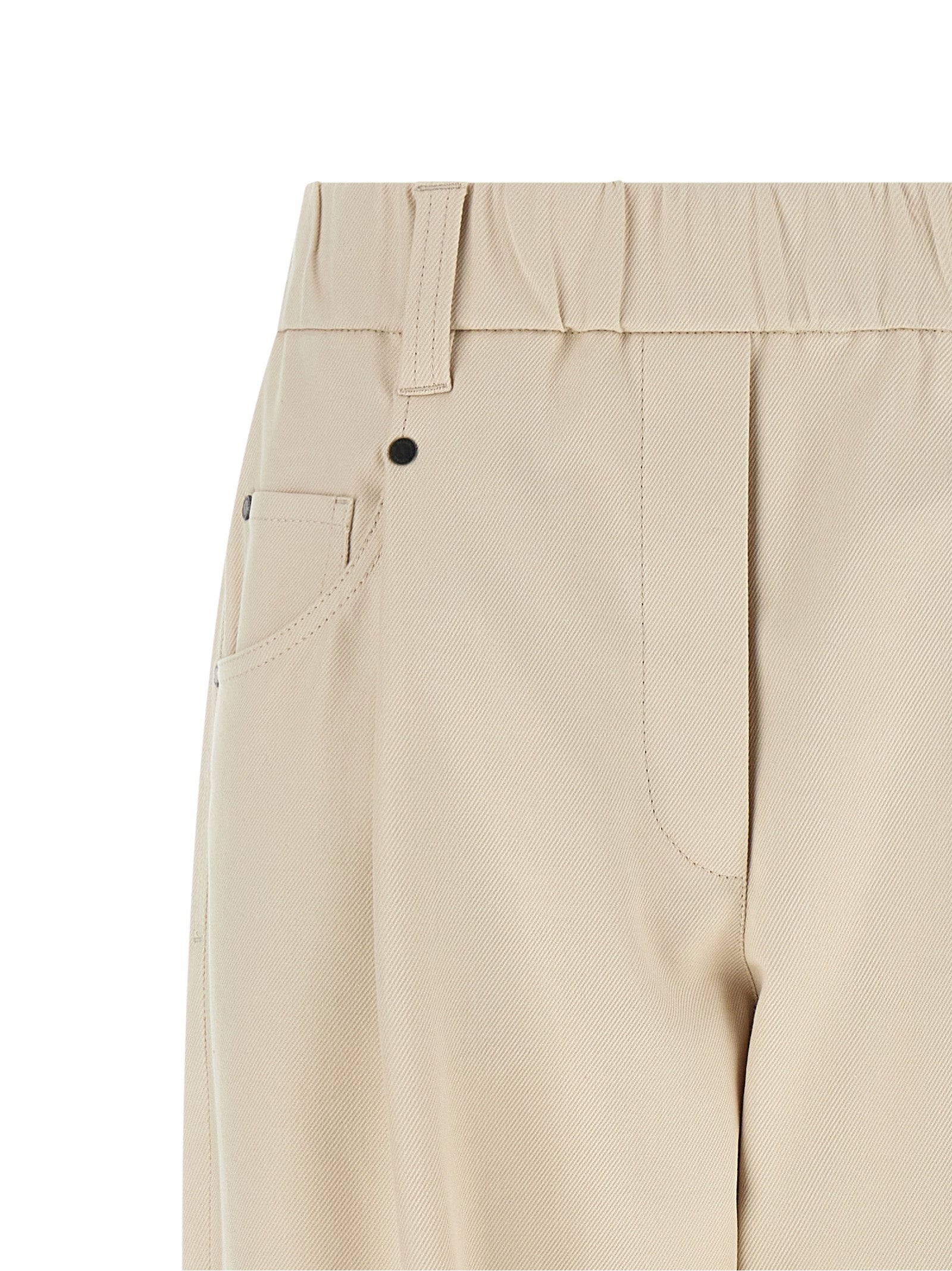 Trousers by Brunello Cucinelli for women in stretch cotton beige presents a smart silhouette, meticulously detailed with a smart tapered-leg & wide, a smart long, and a smart mid rise.