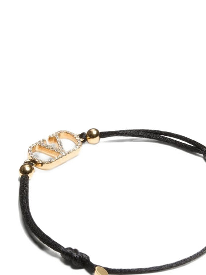 Bracelet by Valentino Garavani for women in nubuck & suede lamb leather and black showcases a refined silhouette, artfully capturing the essence of V Logo Women's Cord Polyester Leather & Rhinestone Bracelet with its refined cord bracelet design.