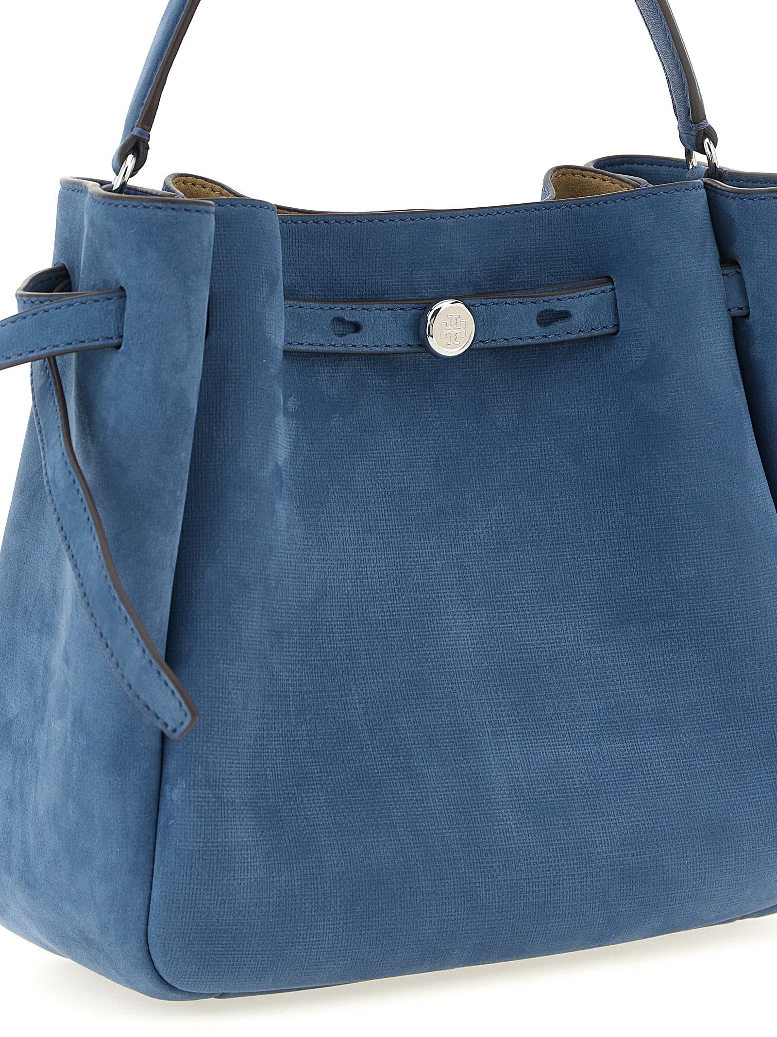 This Crossbody Bucket Handbag by Tory Burch for women in nubuck & suede lamb leather and blue presents a sculptural silhouette featuring a secure snap, magnetic & button, ample , and versatile crossbody-strap, shoulder-strap, handle, adjustable-strap & belt-strap for a sculptural finish.