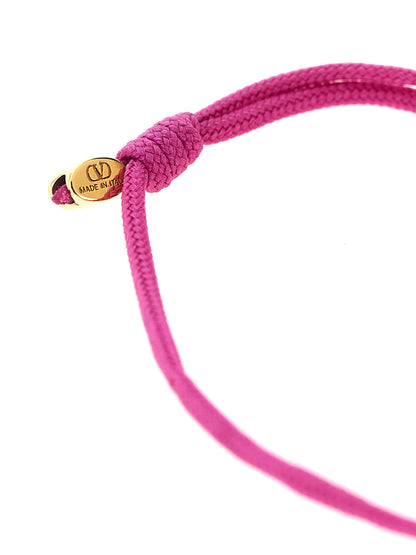 Bracelet by Valentino Garavani for women in cotton multicolor showcases a luminous cord bracelet design, artfully capturing the essence of the luminous Essence V Logo Women's Cord Polyester Leather Bracelet collection.