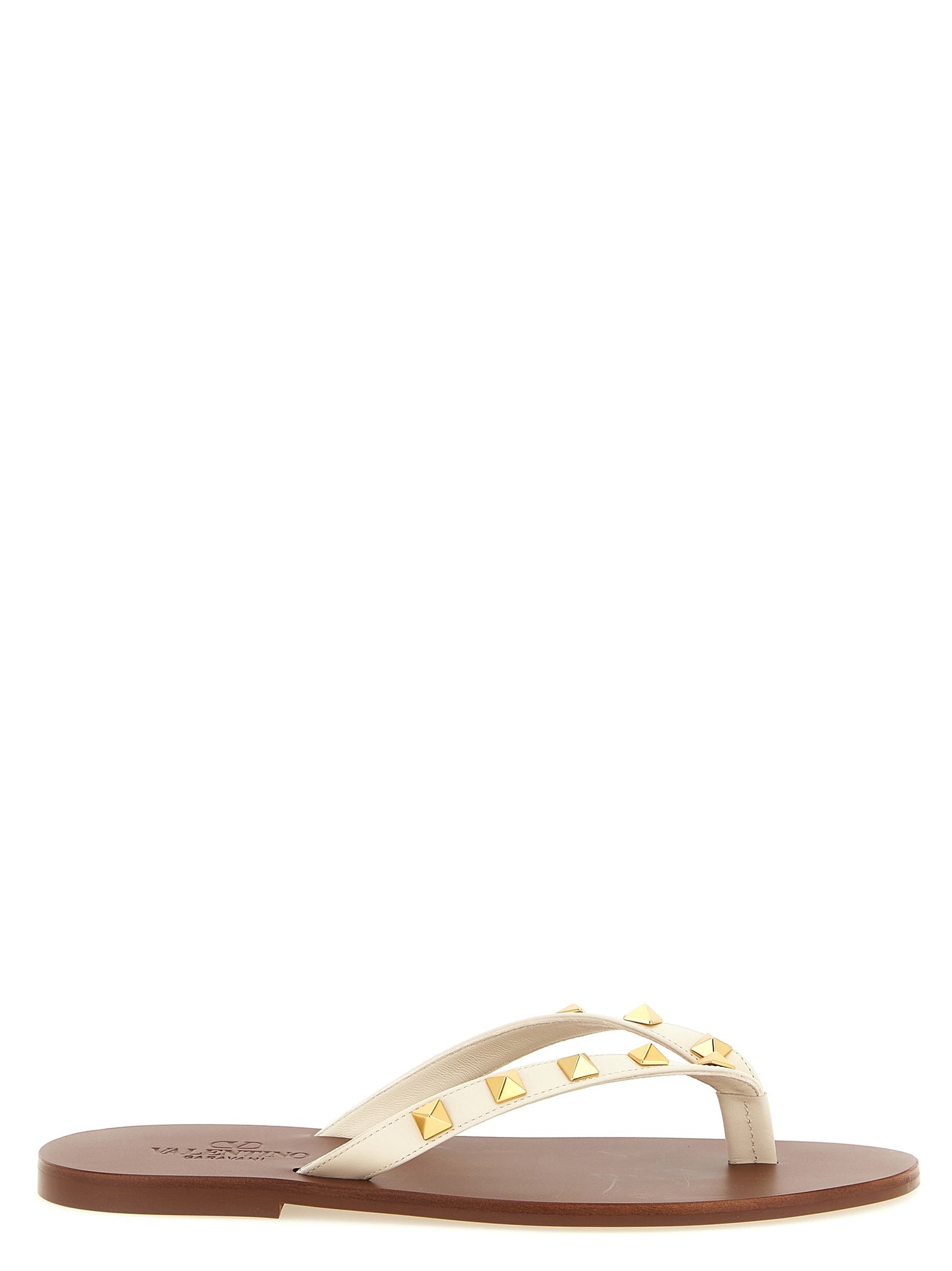 Sliders Sandals Flat Shoes by Valentino Garavani for women in calfskin leather white & signature presents a impeccable silhouette as Rockstud Women's Calfskin Leather Sliders Sandals Flat Shoes, artfully designed with a and a impeccable for a refined, upscale finish.