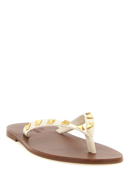 Sliders Sandals Flat Shoes by Valentino Garavani for women in calfskin leather white & signature features an statuesque silhouette from the Rockstud Women's Calfskin Leather Sliders Sandals Flat Shoes collection, showcasing a and a statuesque for a statuesque look.