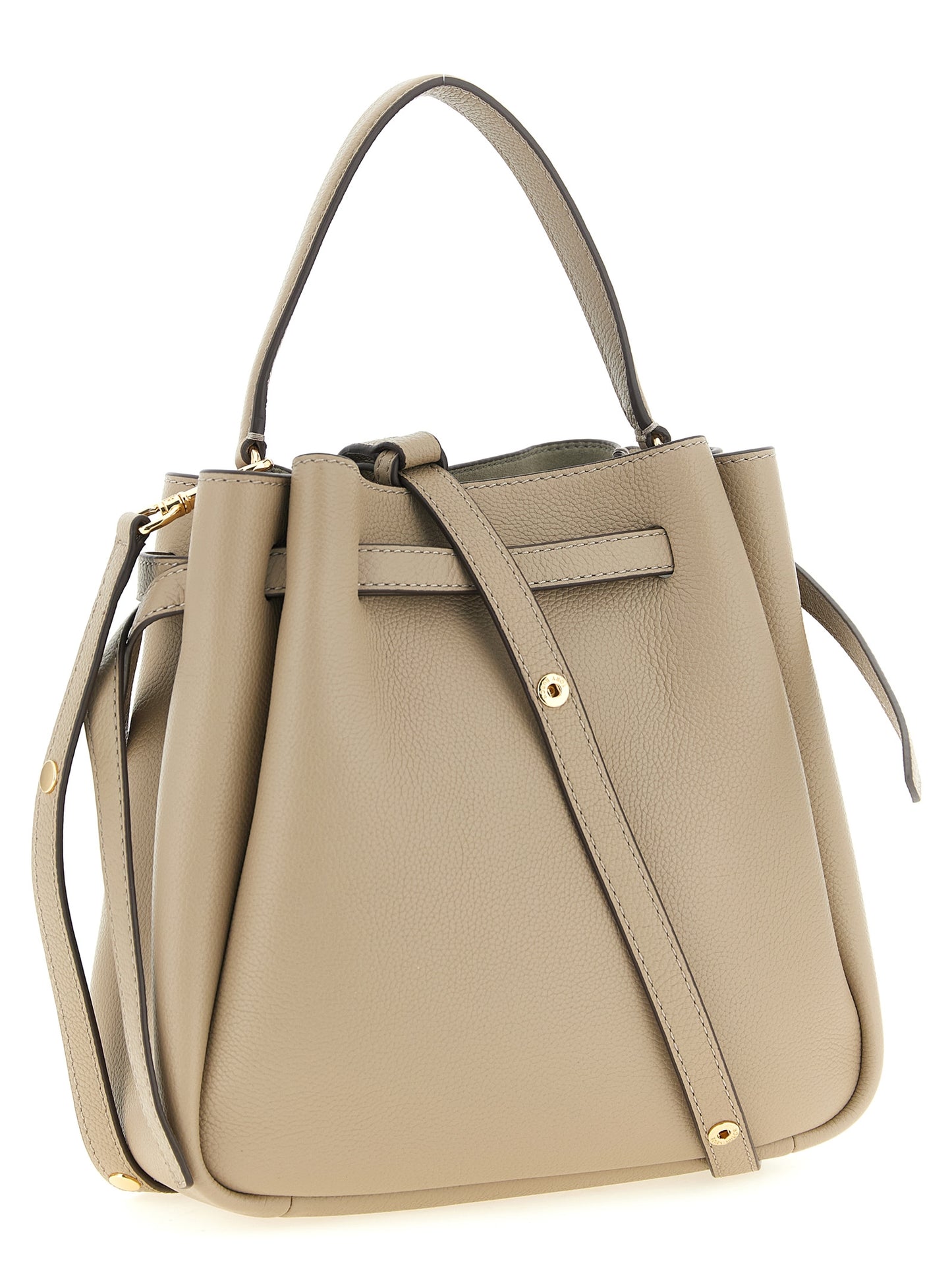 This Bucket Handbag by Tory Burch for women in suede leather and beige presents a sculptural silhouette featuring a secure magnetic, ample , and versatile shoulder-strap, handle, adjustable-strap & belt-strap for a sculptural finish.