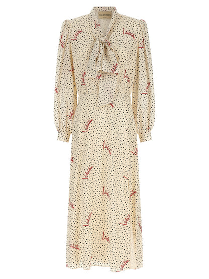 Dress by Valentino Garavani for women in silk black, ivory, multicolor, red, dots & print showcases a striking silhouette, elegantly detailed with a long-sleeve, refined lapel neckline, and a striking midi for a striking finish.