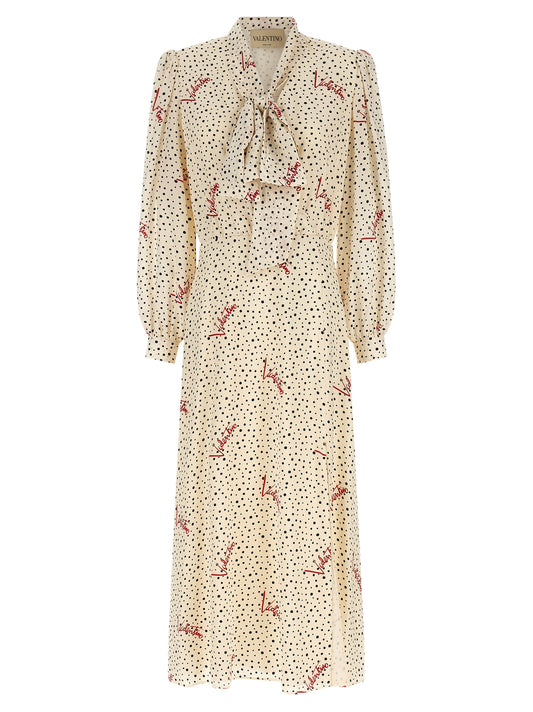 Dress by Valentino Garavani for women in silk black, ivory, multicolor, red, dots & print showcases a striking silhouette, elegantly detailed with a long-sleeve, refined lapel neckline, and a striking midi for a striking finish.