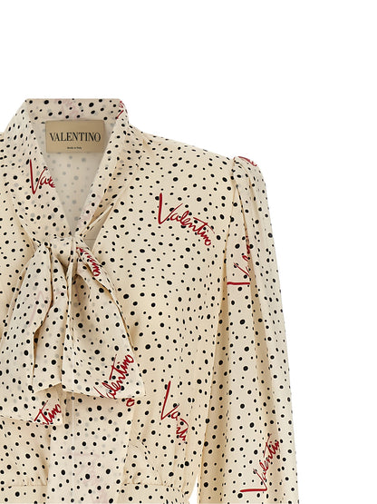 Dress by Valentino Garavani for women in silk black, ivory, multicolor, red, dots & print features an eye catching silhouette with a sophisticated lapel neckline, elegant , and a refined midi for a eye catching aesthetic.